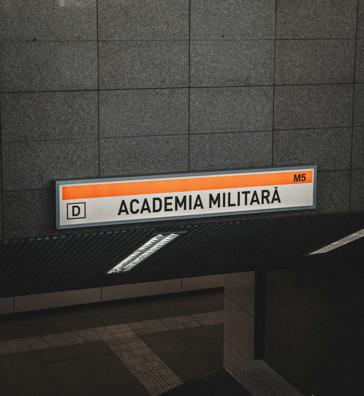 an orange and white sign hanging from the side of a building