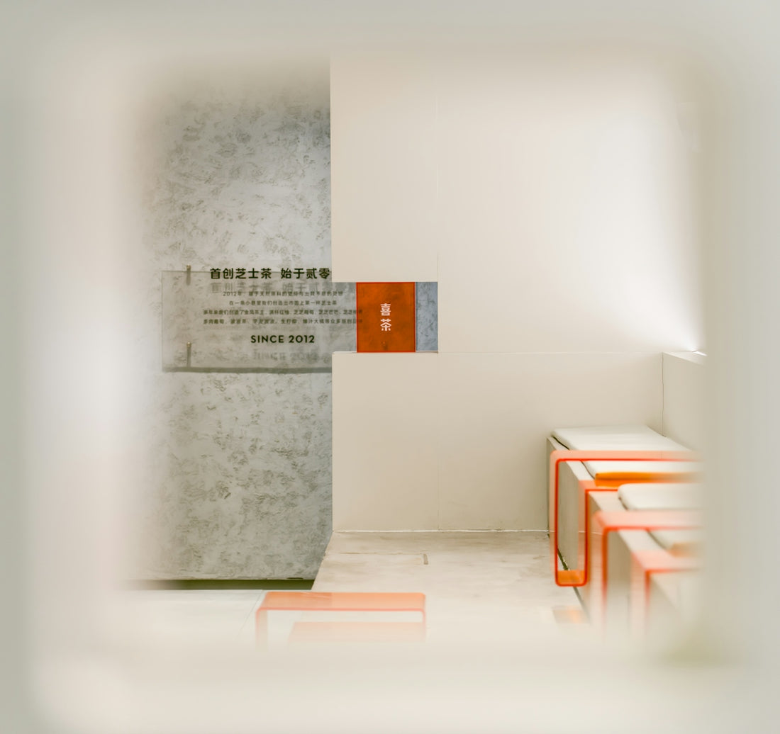 A white room with a red door and a white wall