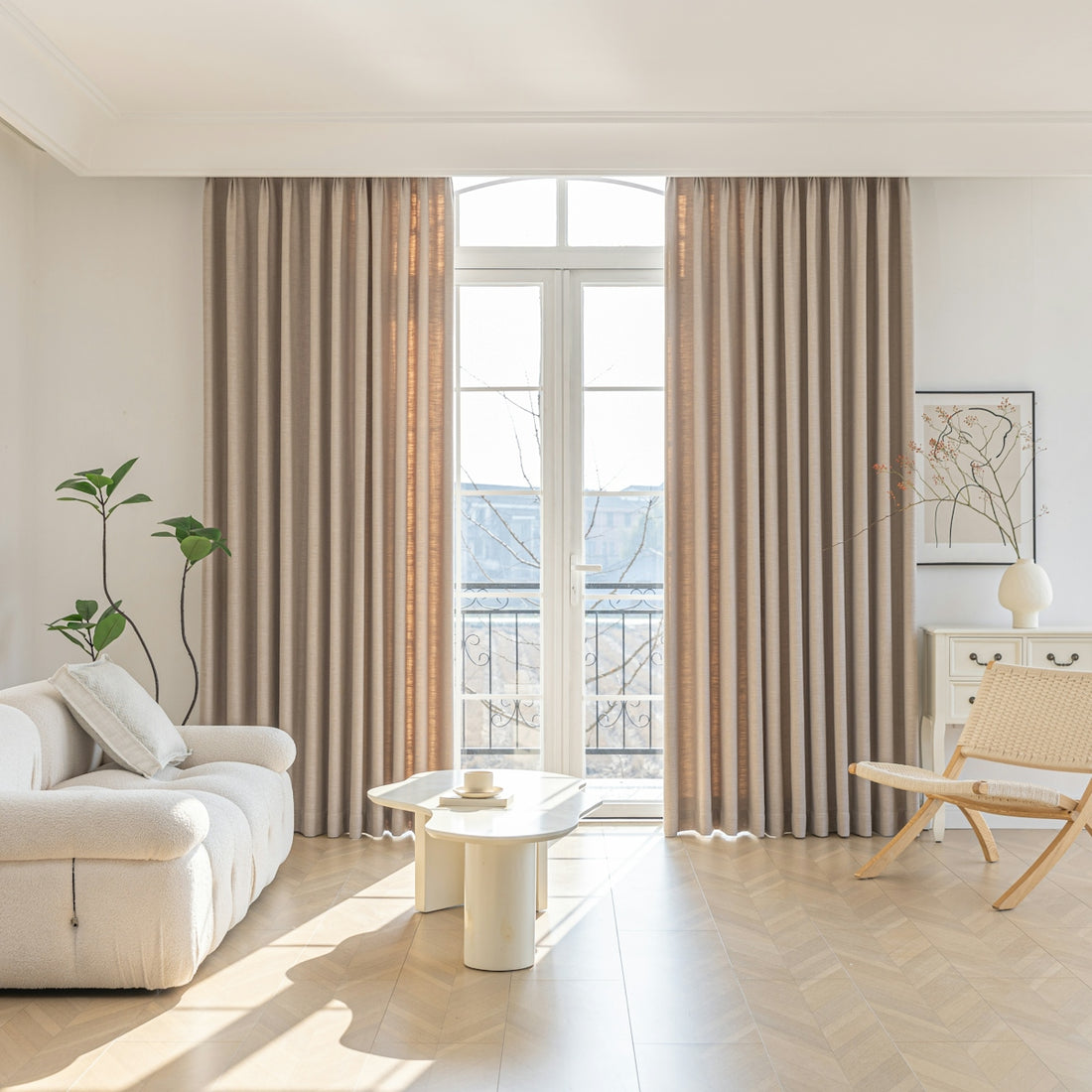 Cozy living room with neutral tones and natural light.