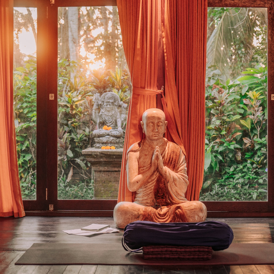 Buddhist statue meditating in a tranquil room