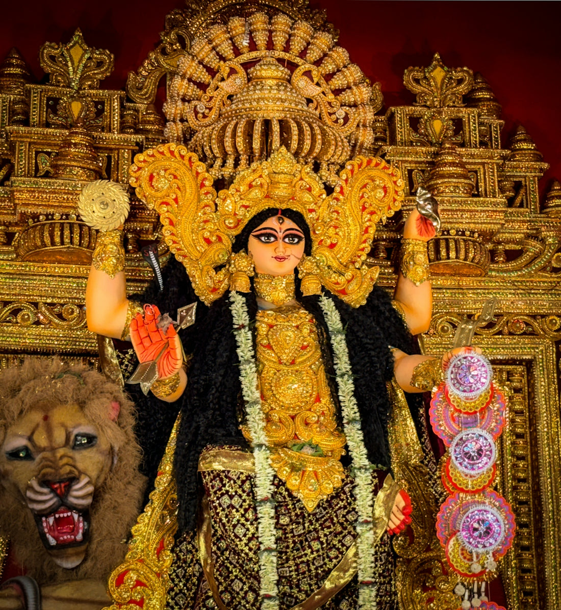 Goddess durga statue with a lion in ornate temple