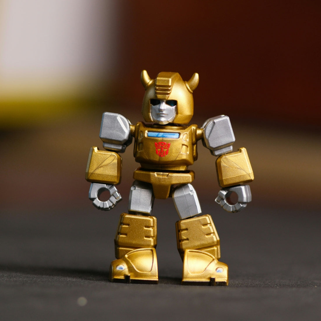 Golden and silver bumblebee transformers toy standing